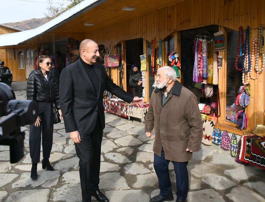 President Ilham Aliyev and First Lady Mehriban Aliyeva talk to residents of Lahij settlement
