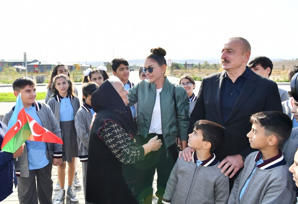President Ilham Aliyev and First Lady Mehriban Aliyeva talk to residents of Aghali village